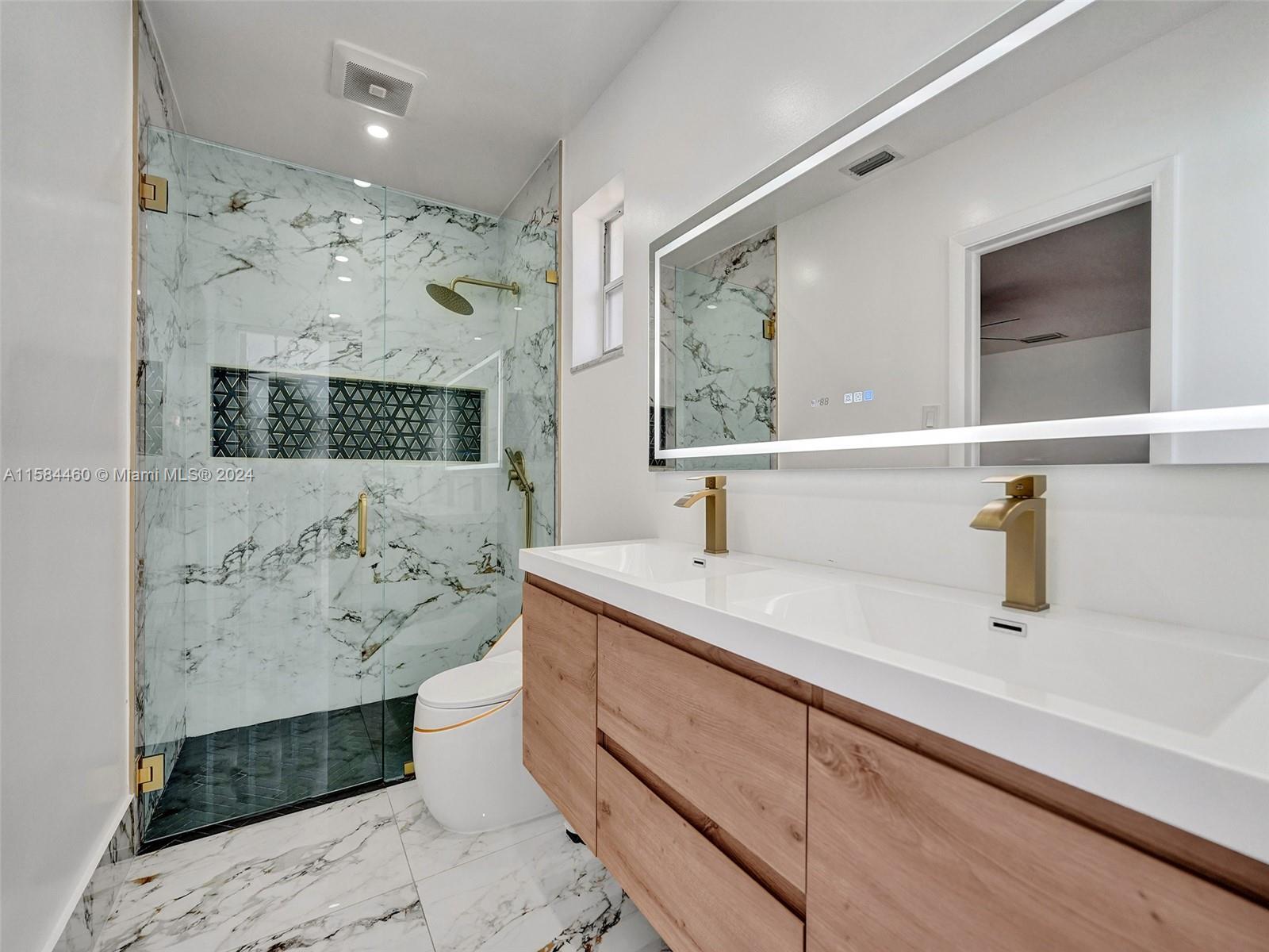 3460 North 46th Avenue Hollywood, FL 33021 - Photo 28 of 35 a bathroom with a sink and a mirror
