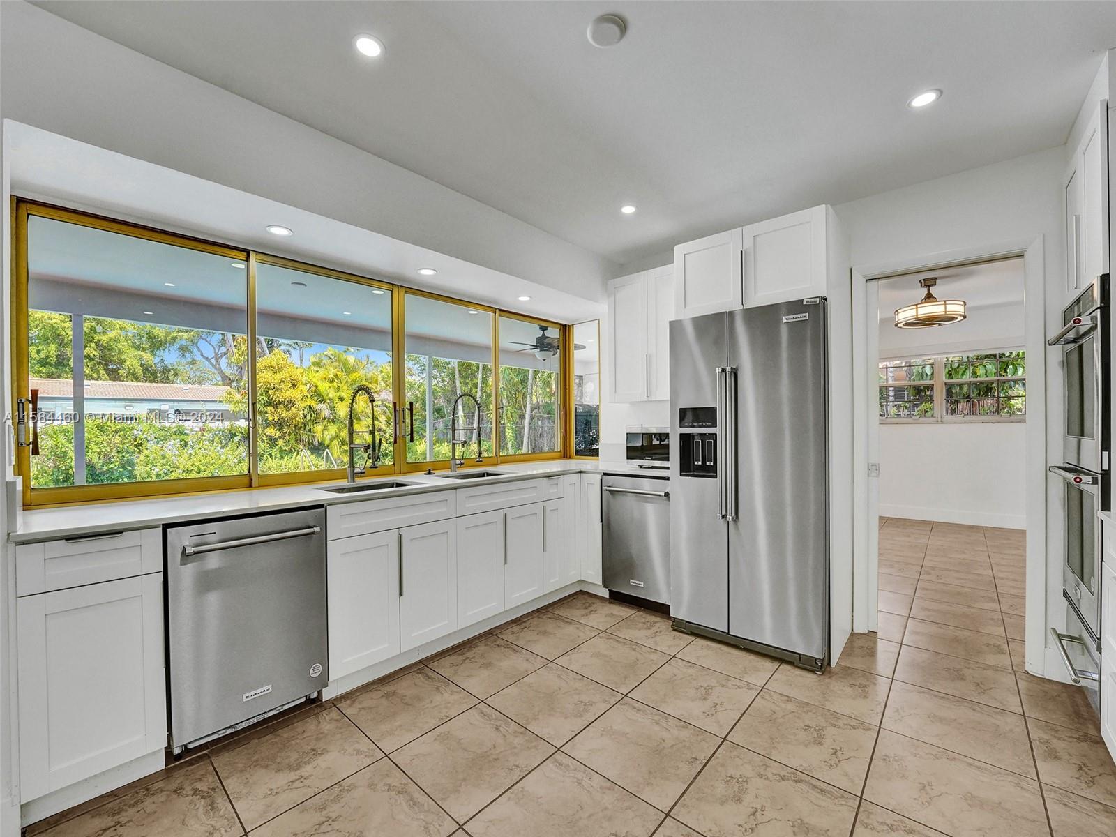 3460 North 46th Avenue Hollywood, FL 33021 - Photo 29 of 35 a kitchen with a refrigerator and a sink