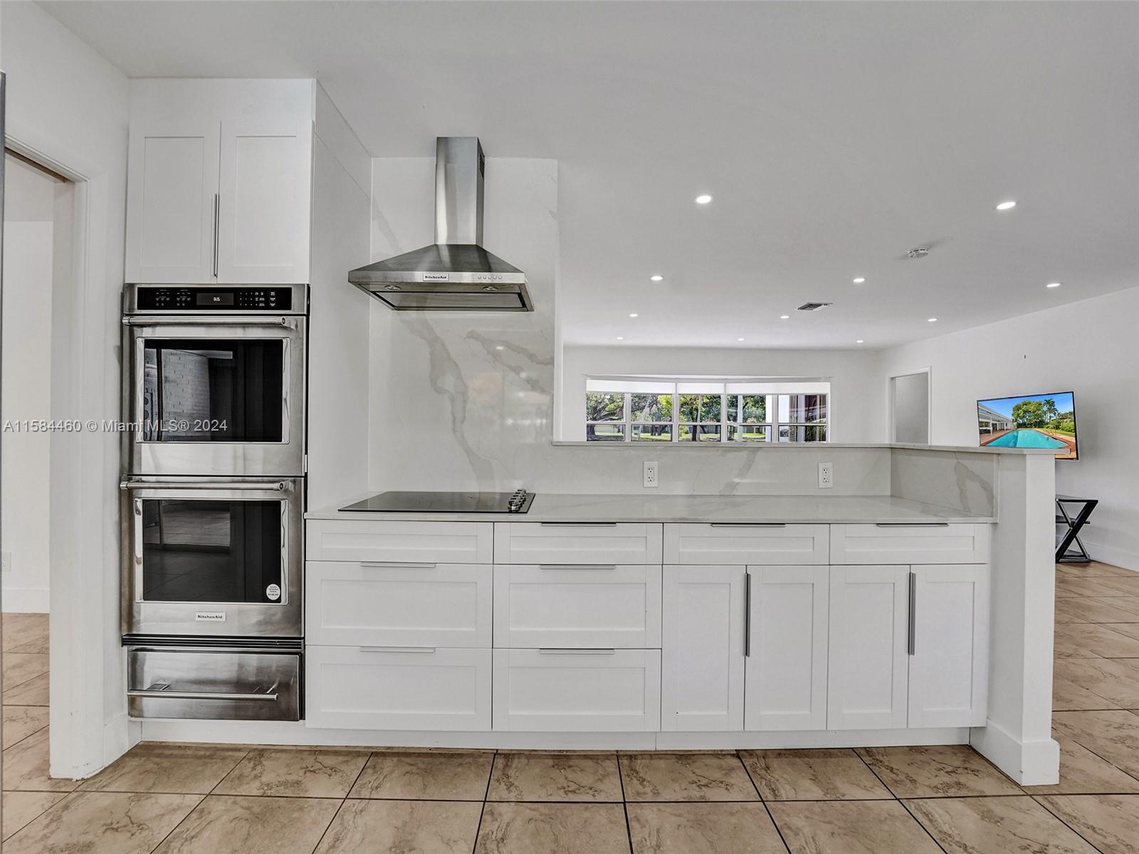 3460 North 46th Avenue Hollywood, FL 33021 - Photo 8 of 35 a kitchen with stainless steel appliances granite countertop a stove and a sink