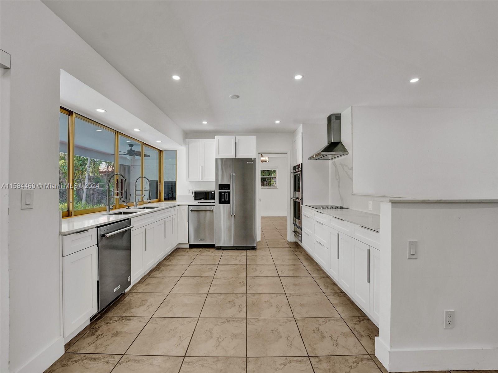 3460 North 46th Avenue Hollywood, FL 33021 - Photo 9 of 35 a large kitchen with stainless steel appliances lots of counter top space