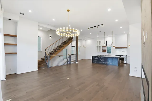 wooden floor and a hallway with a dining table chairs