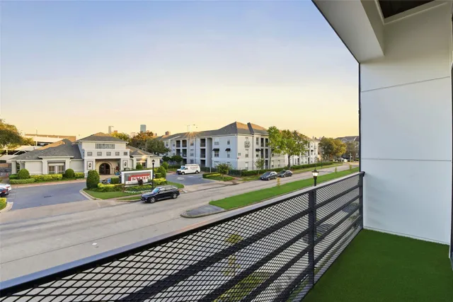 a view of a city street with tall buildings