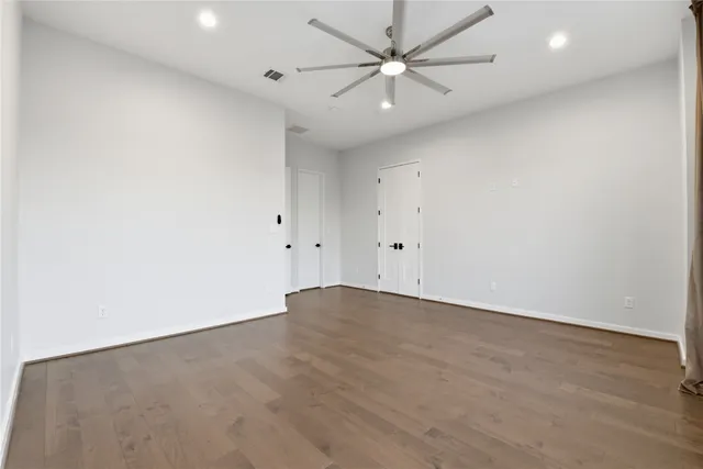 an empty room with fan