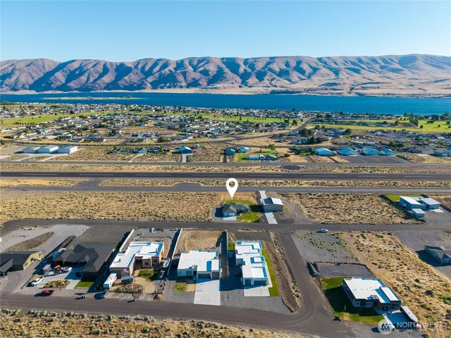 an aerial view of a residential houses with outdoor space