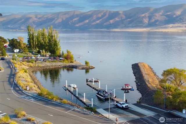 an aerial view of a residential houses with outdoor space