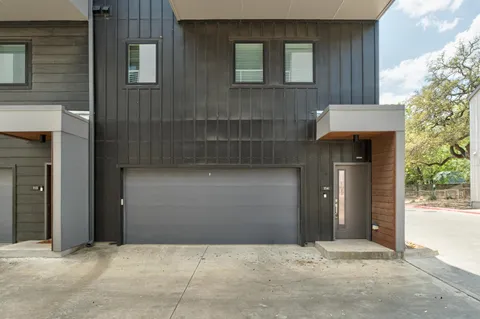 a front view of a house with a garage