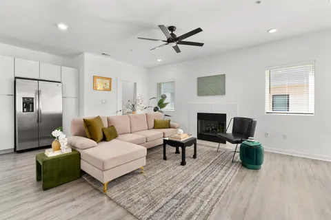 a living room with furniture and a fireplace