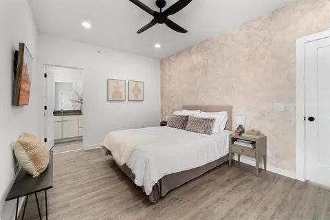 a bedroom with bed and window