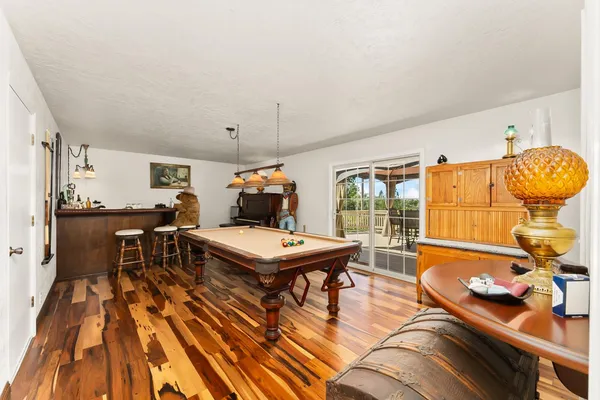 a living room with furniture a rug and a table