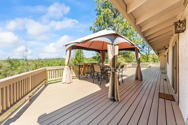 a view of a balcony with wooden floor