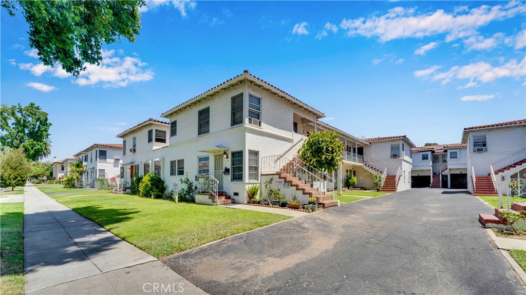 30 North 1st Street Alhambra, CA 91801 - Photo 2 of 12 a view of a white house with a big yard plants and large trees