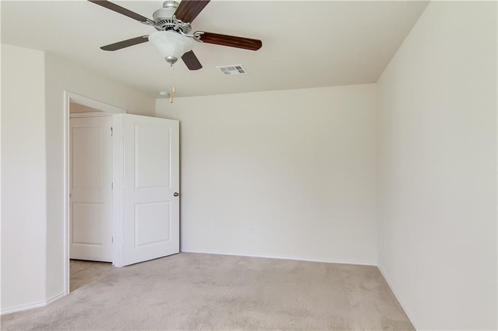 5916 Kennedy Street Austin, TX 78747 - Photo 14 of 25 Unfurnished bedroom featuring light carpet and ceiling fan