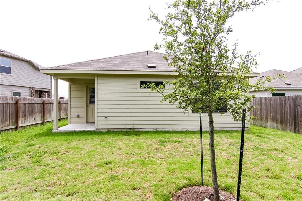5916 Kennedy Street Austin, TX 78747 - Photo 20 of 25 Back of property with a fenced backyard, a patio, and roof with shingles