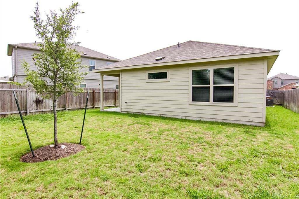5916 Kennedy Street Austin, TX 78747 - Photo 21 of 25 Back of property featuring a fenced backyard and roof with shingles