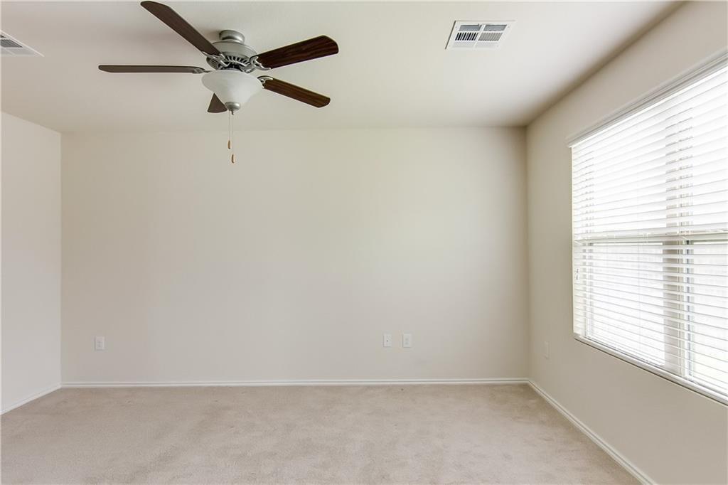 5916 Kennedy Street Austin, TX 78747 - Photo 8 of 25 Unfurnished room featuring ceiling fan and light colored carpet