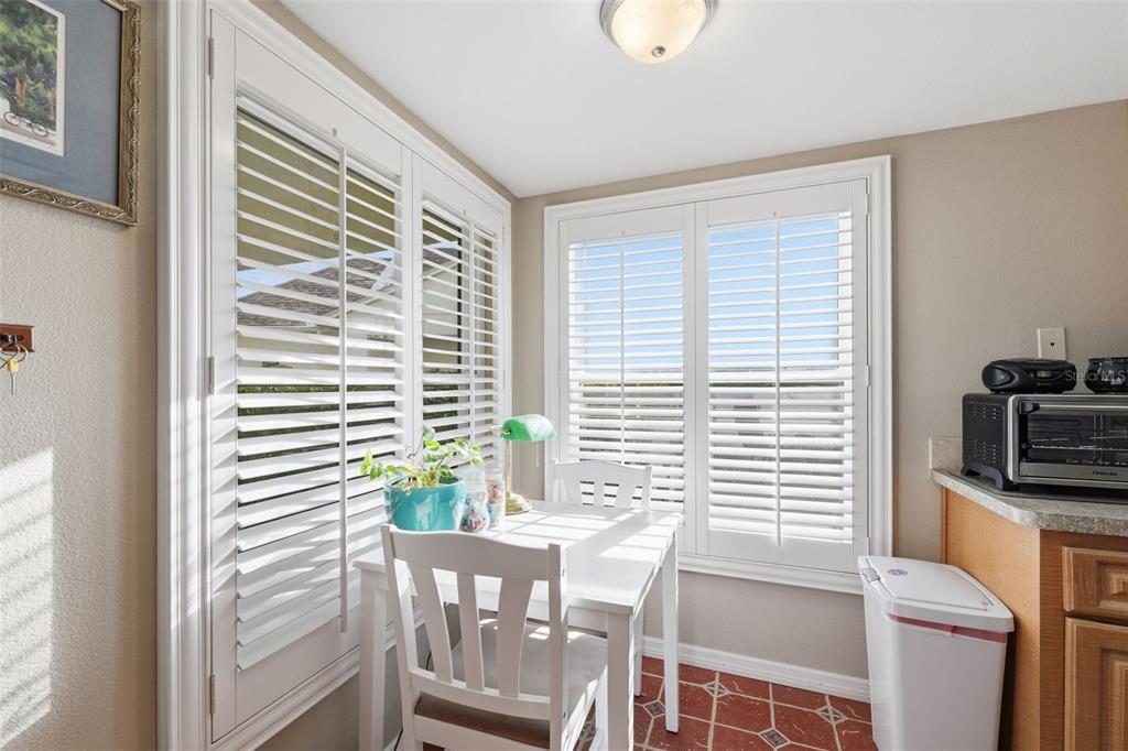 11541 Orleans Lane Port Richey, FL 34668 - Photo 16 of 53 a view of a dining room with furniture and a window