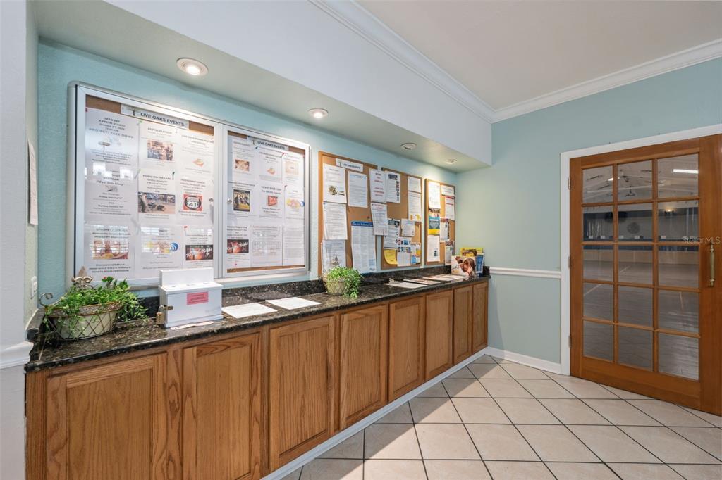 11541 Orleans Lane Port Richey, FL 34668 - Photo 30 of 53 a kitchen with granite countertop a refrigerator and a sink