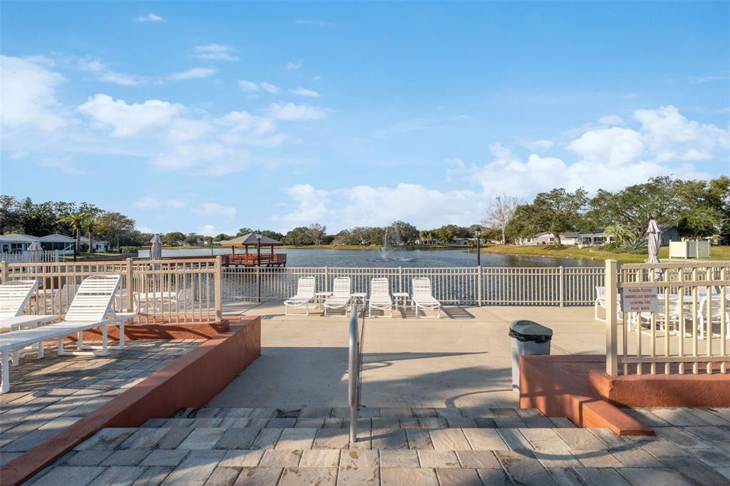 11541 Orleans Lane Port Richey, FL 34668 - Photo 44 of 53 a view of a lake with a terrace