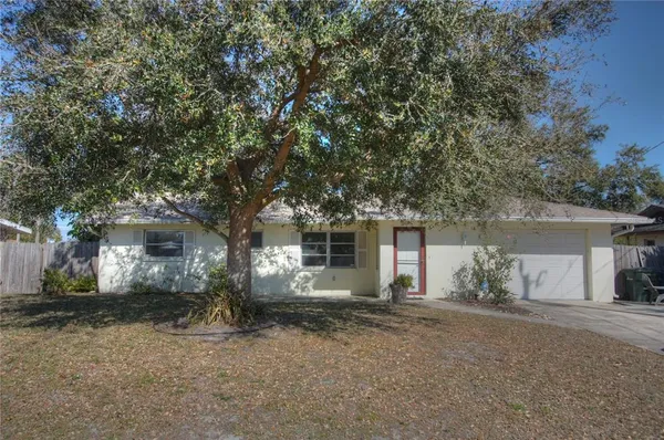 front view of house with a trees
