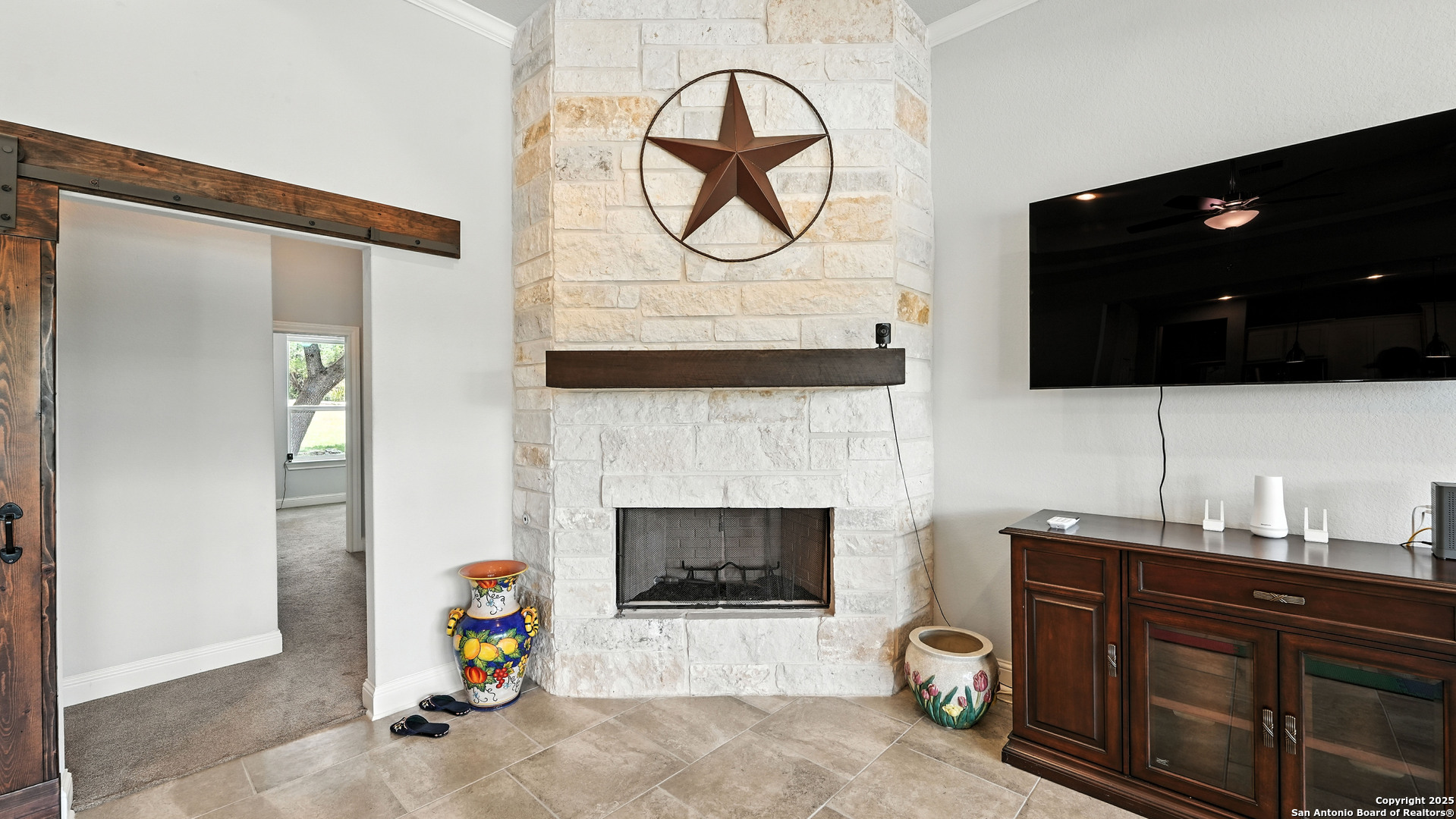 179 Prairie Dawn Spring Branch, TX 78070 - Photo 12 of 45 a living room with furniture and a fireplace