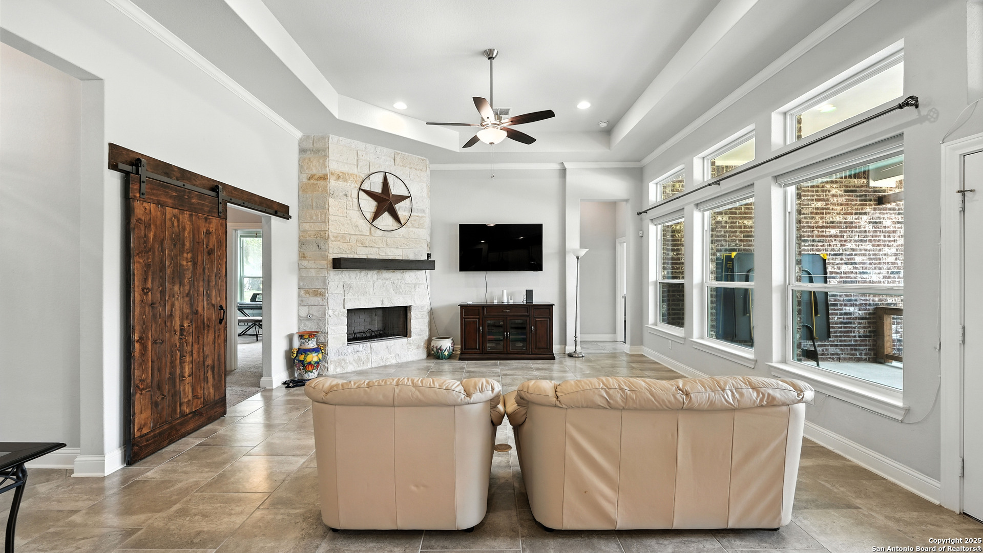 179 Prairie Dawn Spring Branch, TX 78070 - Photo 14 of 45 a living room with fireplace furniture and a flat screen tv