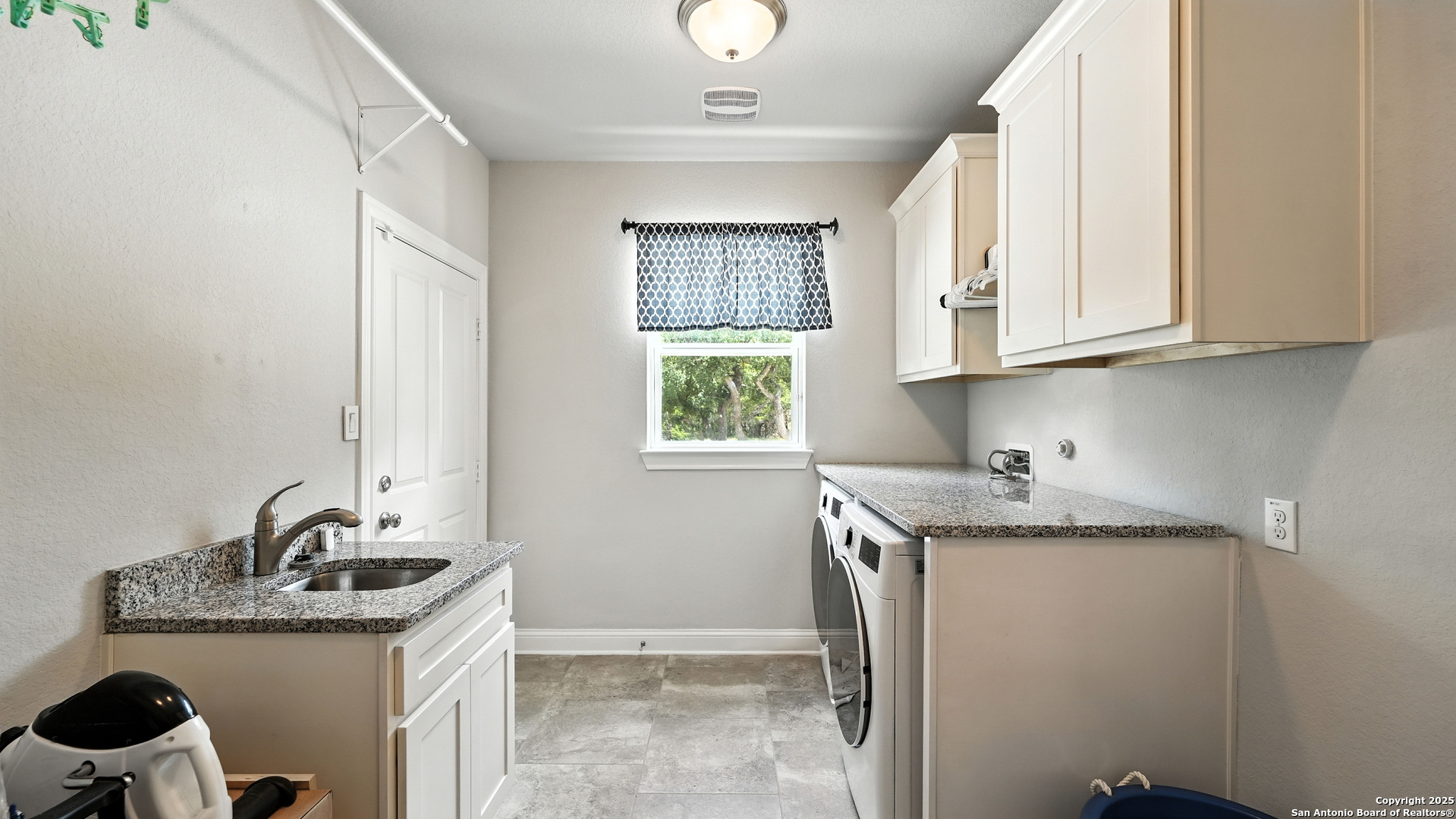179 Prairie Dawn Spring Branch, TX 78070 - Photo 19 of 45 a kitchen with stainless steel appliances granite countertop a sink stove and cabinets