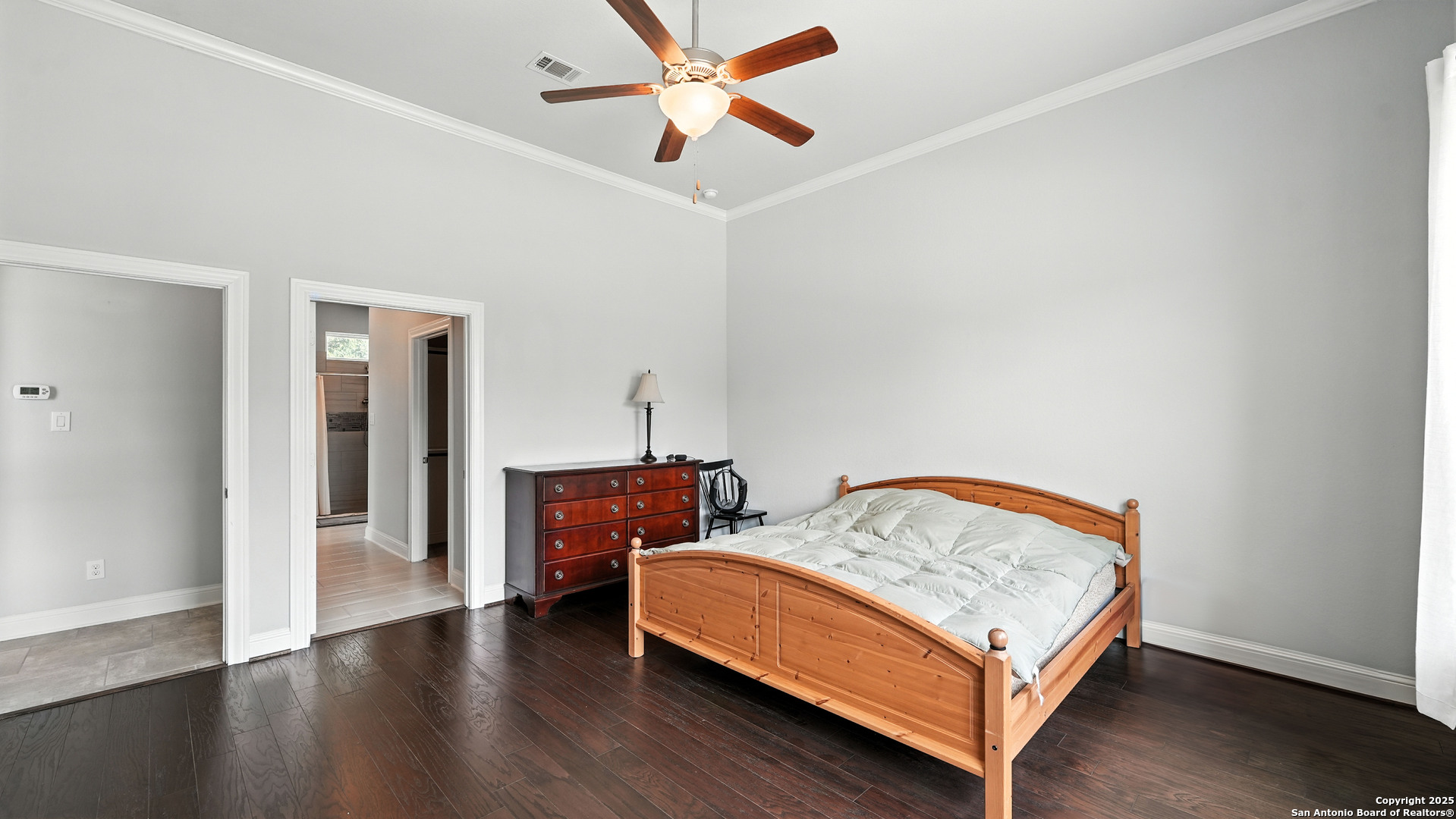 179 Prairie Dawn Spring Branch, TX 78070 - Photo 20 of 45 a bedroom with a bed and wooden floor