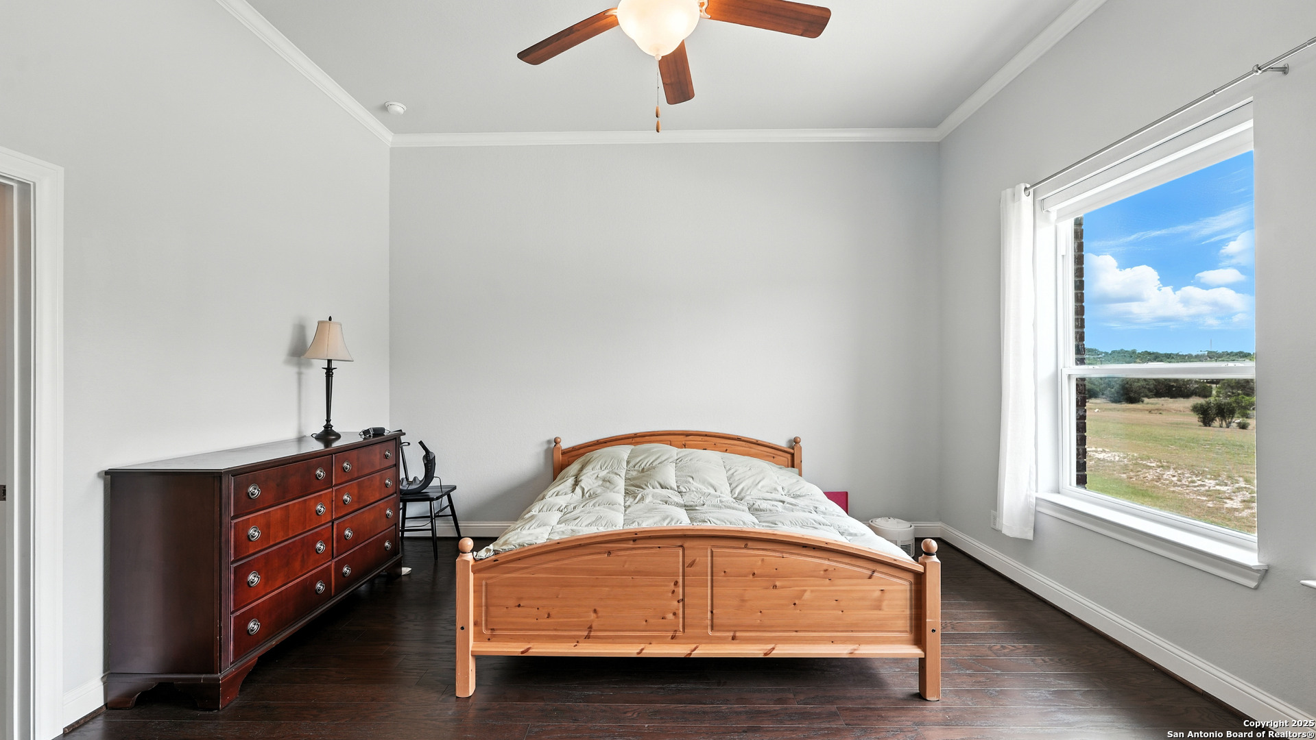 179 Prairie Dawn Spring Branch, TX 78070 - Photo 21 of 45 a room with a bed and window