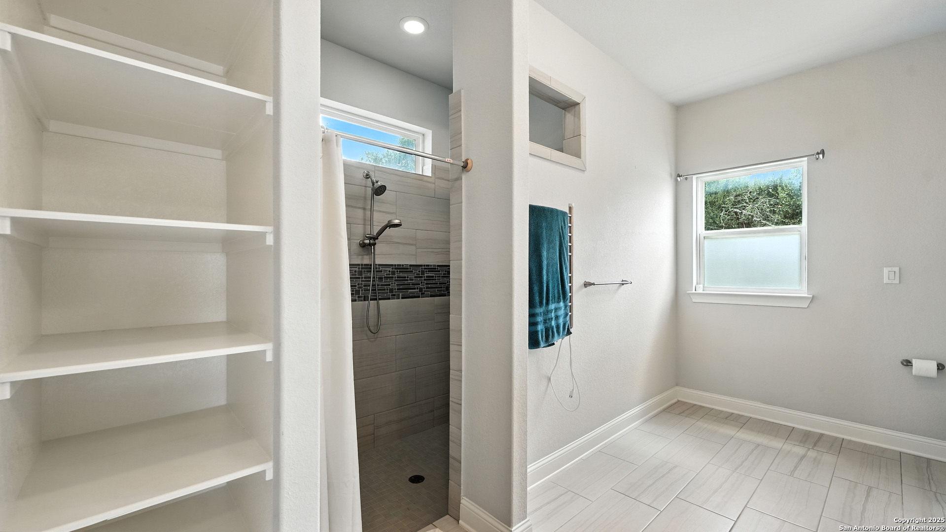 179 Prairie Dawn Spring Branch, TX 78070 - Photo 24 of 45 a view of a bathroom with a glass door and a shower
