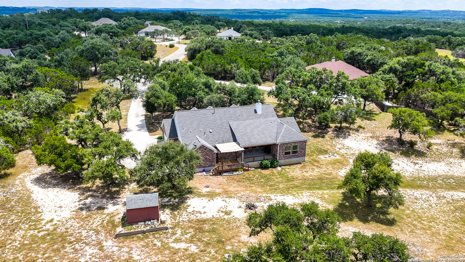 179 Prairie Dawn Spring Branch, TX 78070 - Photo 40 of 45 an aerial view of a house with yard and outdoor seating
