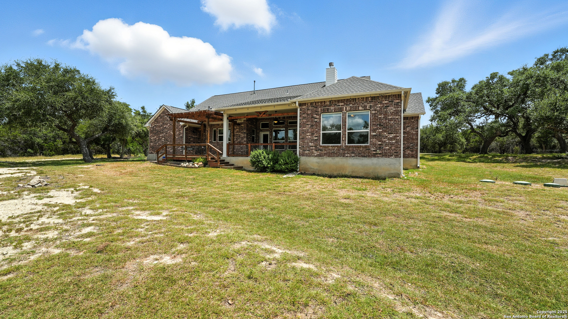 179 Prairie Dawn Spring Branch, TX 78070 - Photo 43 of 45 a view of a house next to a big yard