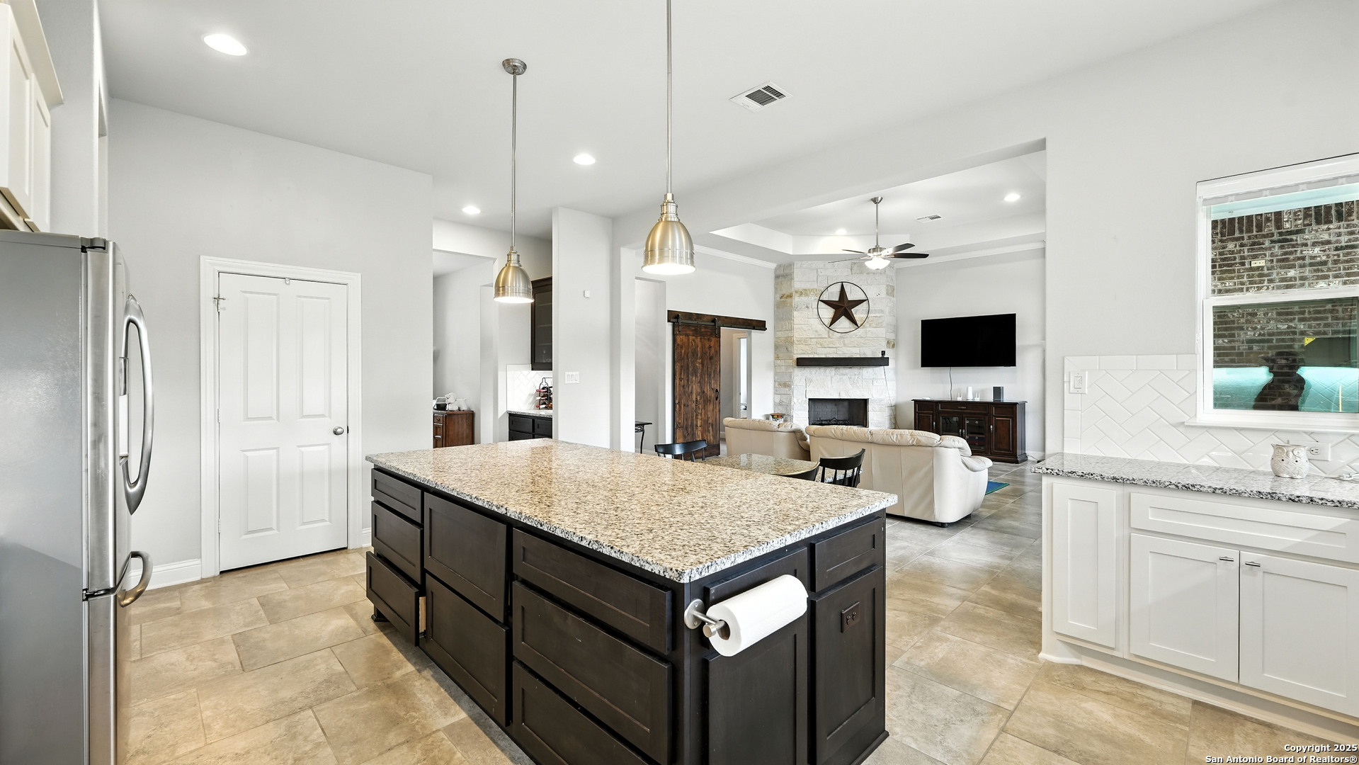 179 Prairie Dawn Spring Branch, TX 78070 - Photo 8 of 45 a view of kitchen island and living room