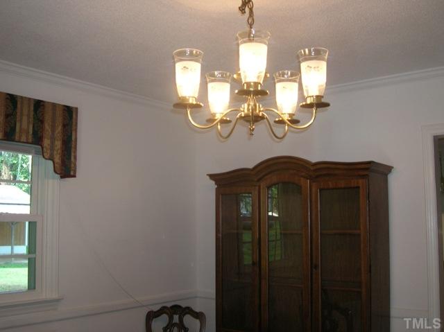 533 Maple Lane Raleigh, NC 27603 - Photo 6 of 25 a view of a hallway with windows