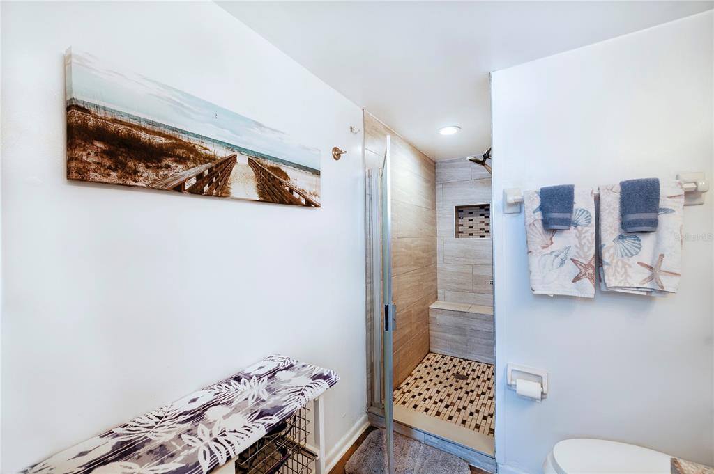 4453 South Atlantic Avenue, Unit 604 Ponce Inlet, FL 32127 - Photo 15 of 28 a walk in closet with view of bedroom and bathroom