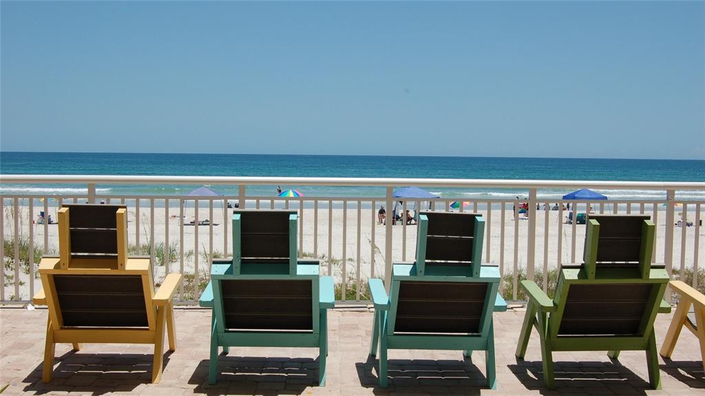 4453 South Atlantic Avenue, Unit 604 Ponce Inlet, FL 32127 - Photo 2 of 28 an living room with furniture and a flat screen tv