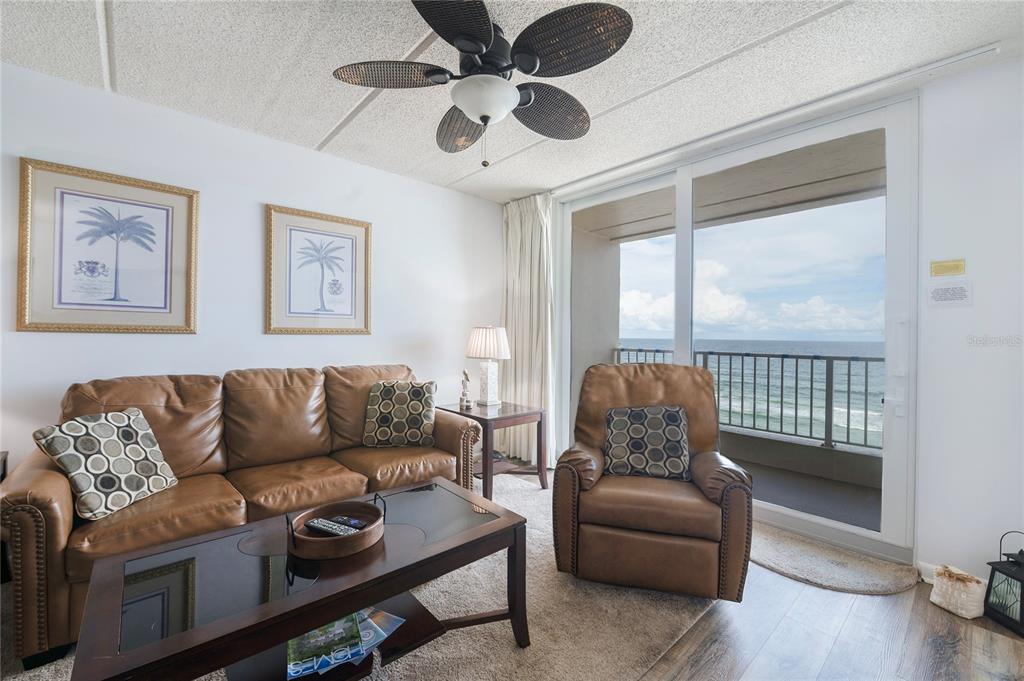 4453 South Atlantic Avenue, Unit 604 Ponce Inlet, FL 32127 - Photo 5 of 28 a living room with furniture and a window