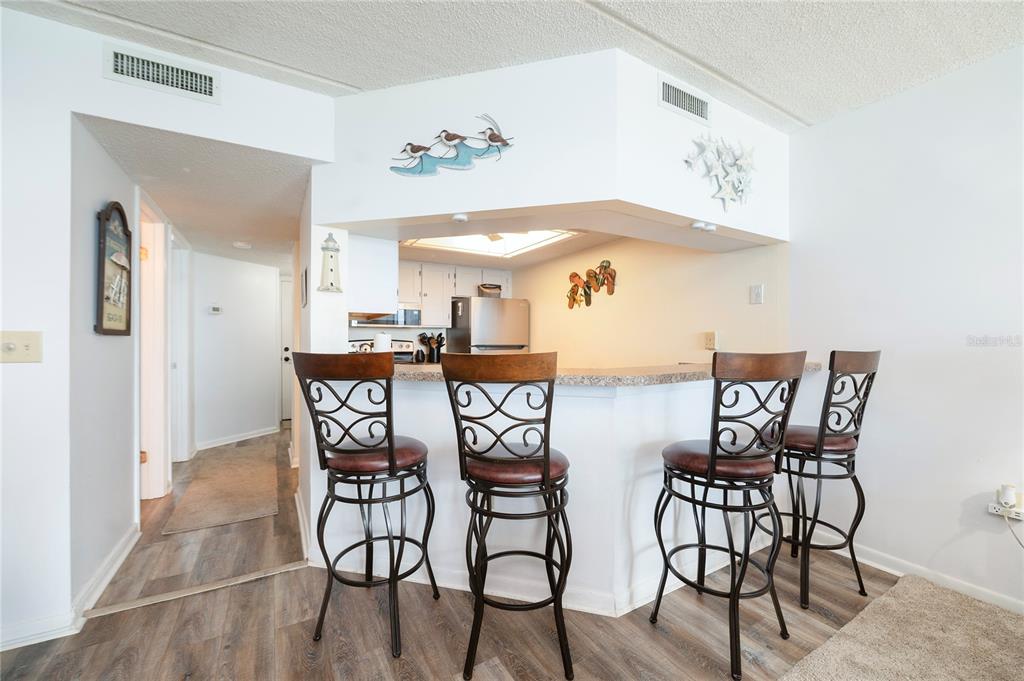 4453 South Atlantic Avenue, Unit 604 Ponce Inlet, FL 32127 - Photo 8 of 28 a view of a dining room with furniture