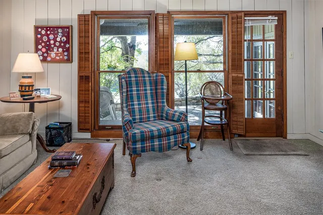 a bedroom with furniture and a window