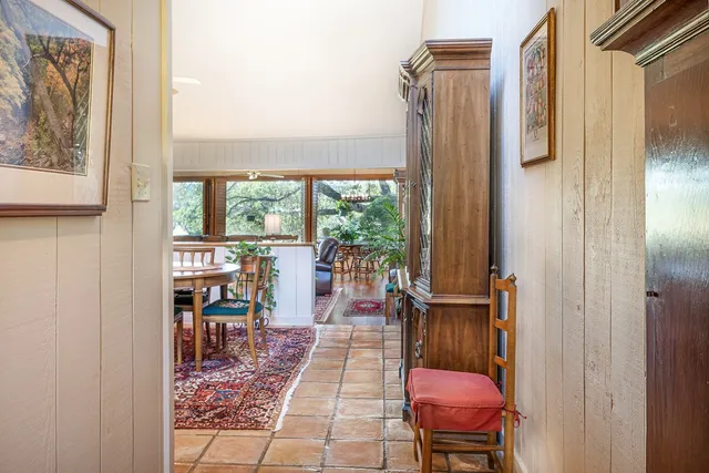 a balcony with table and chairs