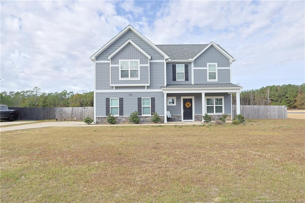 7810 Rufus Johnson Road St. Pauls, NC 28384 - Photo 2 of 27 a front view of a house with garden