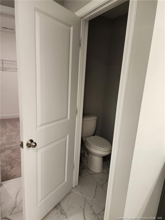 7810 Rufus Johnson Road St. Pauls, NC 28384 - Photo 23 of 27 a white toilet sitting next to a shower