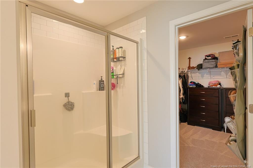 7810 Rufus Johnson Road St. Pauls, NC 28384 - Photo 10 of 24 a bathroom with a shower and a sink