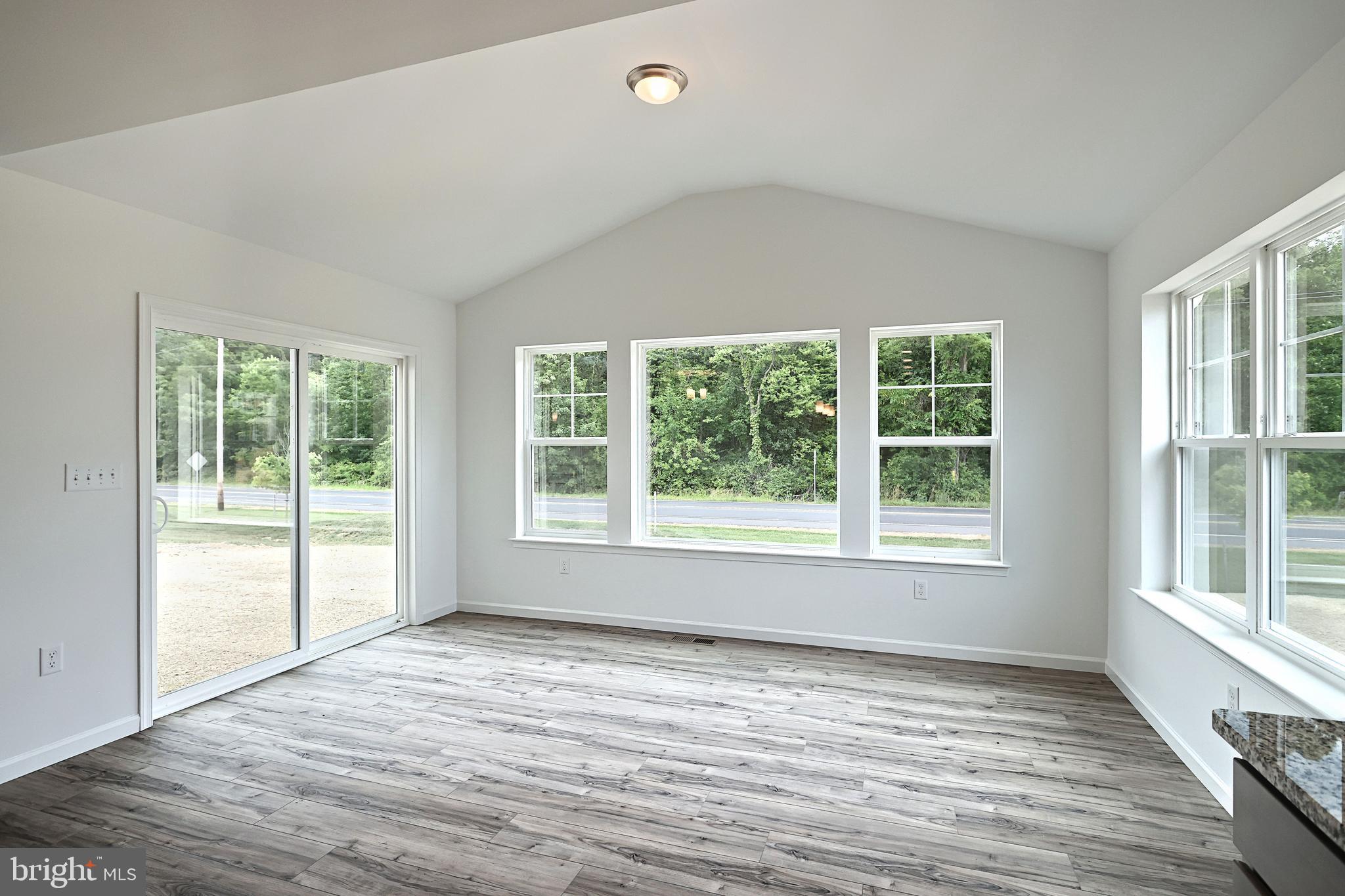 Emily Plan At Hickory Pointe Waynesboro, PA 17268 - Photo 11 of 22 a view of an empty room with wooden floor and a window