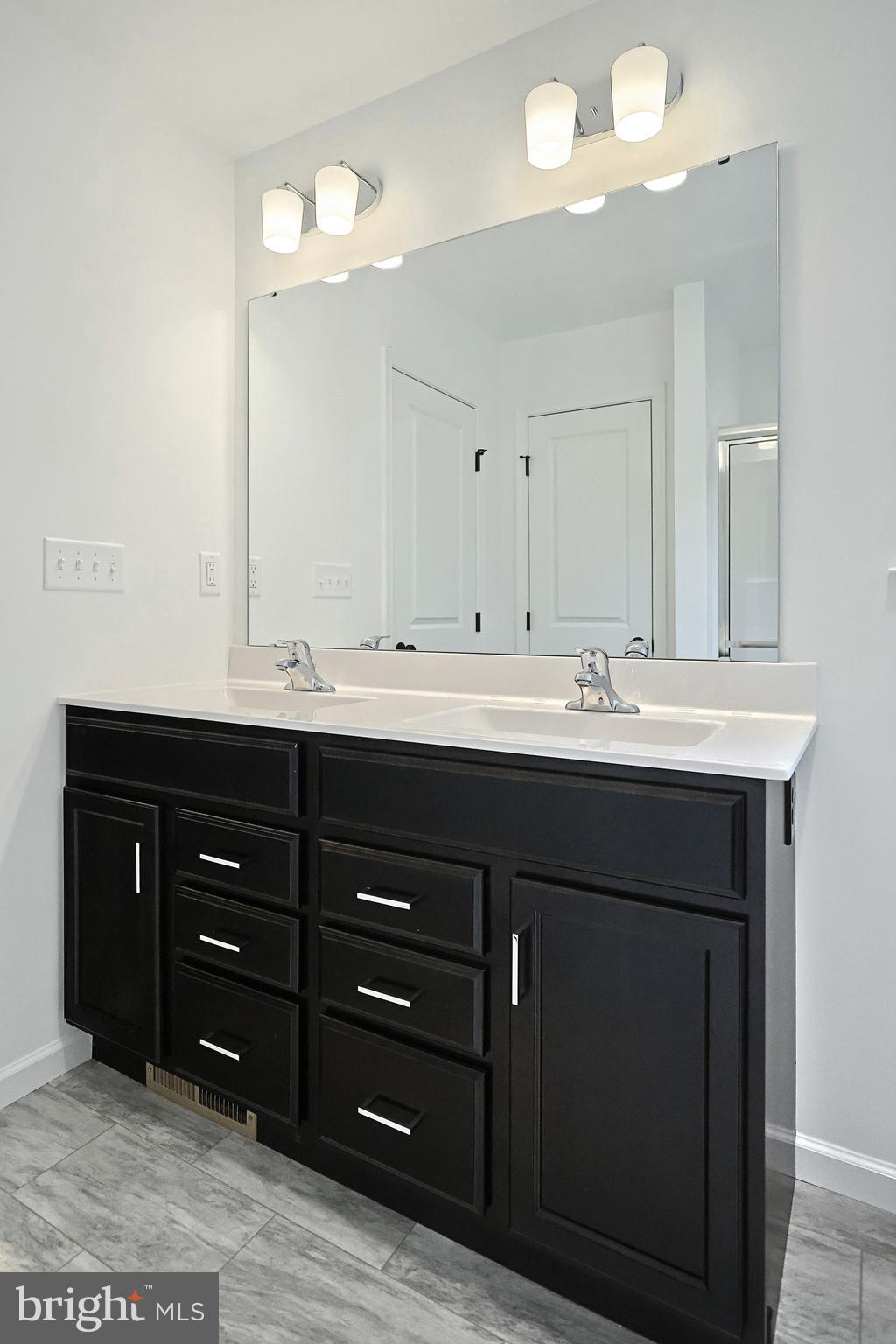 Emily Plan At Hickory Pointe Waynesboro, PA 17268 - Photo 17 of 22 a bathroom with a sink vanity and a mirror