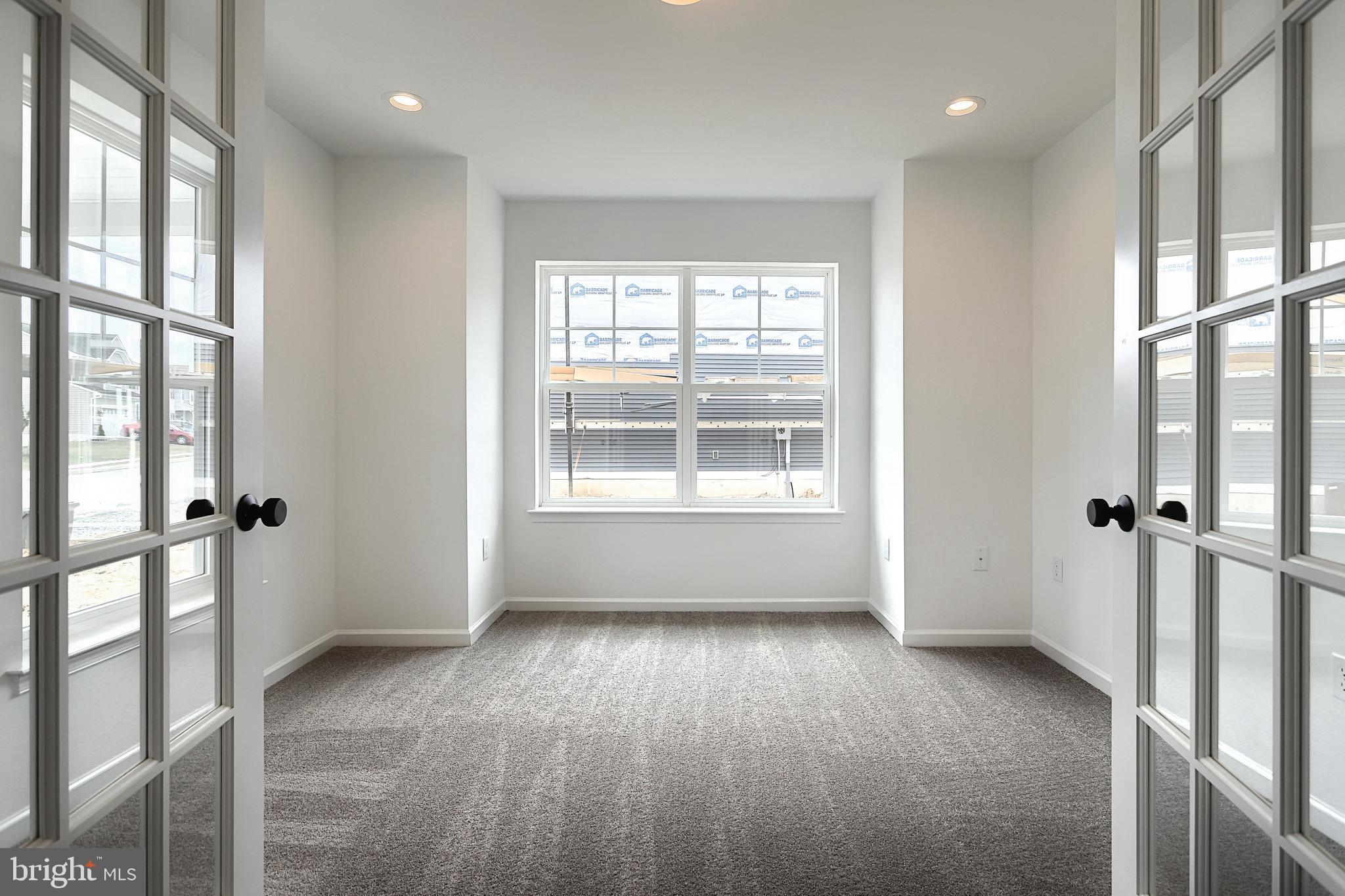 Emily Plan At Hickory Pointe Waynesboro, PA 17268 - Photo 3 of 22 a view of an empty room with a window and wooden floor