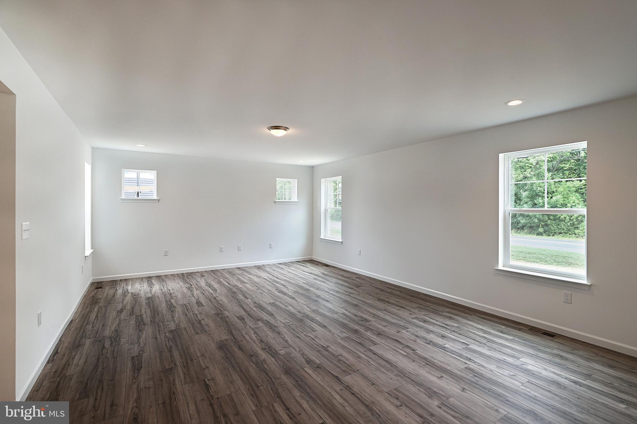 Emily Plan At Hickory Pointe Waynesboro, PA 17268 - Photo 7 of 22 an empty room with wooden floor and windows