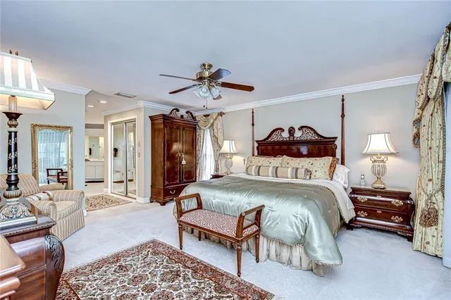 a bedroom with a bed a couch and dresser