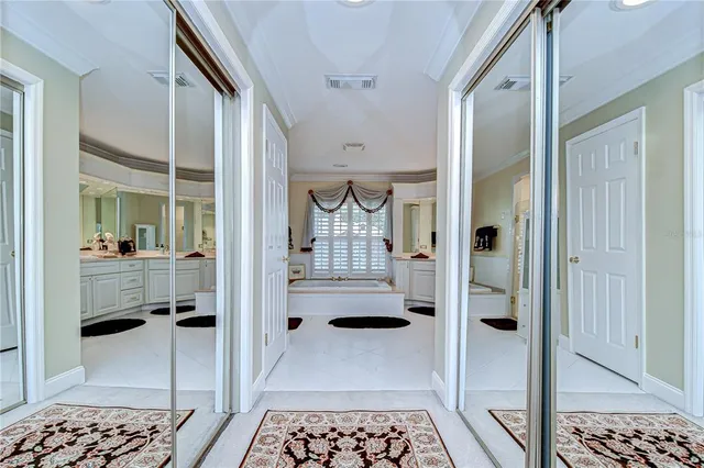 a bathroom with a glass shower door