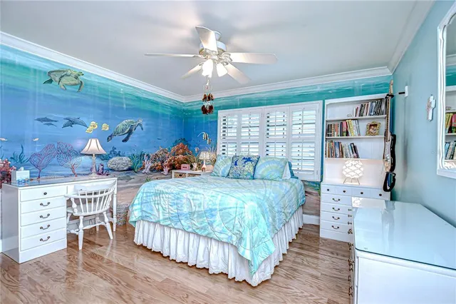 a bedroom with bed and wooden floor