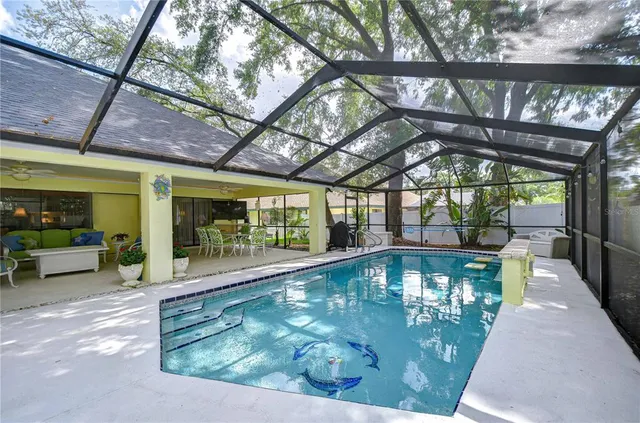 a view of a swimming pool with a patio